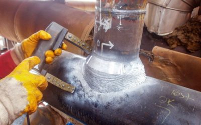 The inspector is testing with magnetic particle inspection method to weldolet of the pipeline. Magnetic particle Inspection (MPI) is a non-destructive testing (NDT) process for detecting surface.